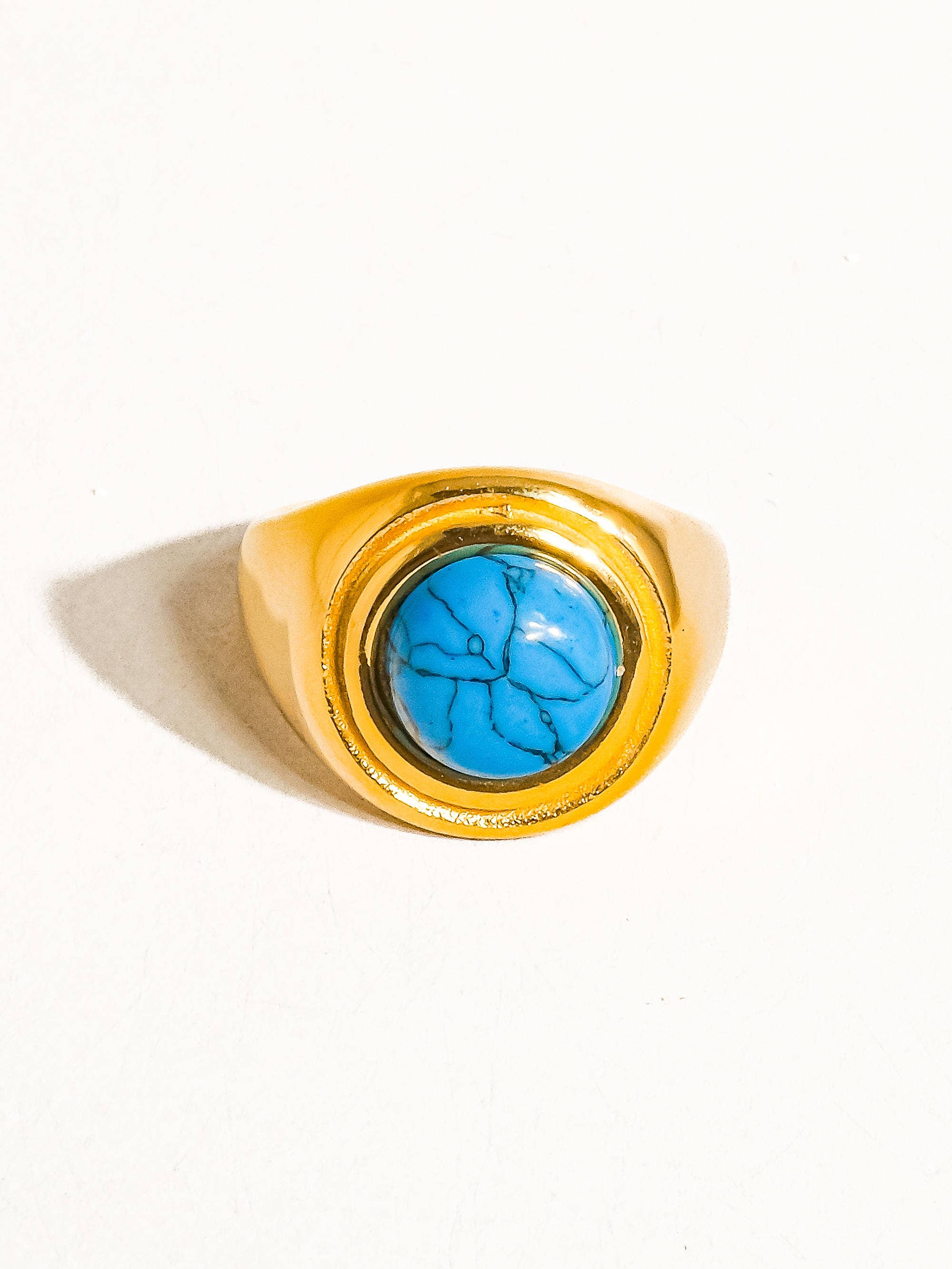 Water-resistant 18K gold turquoise ring showing detailed stone